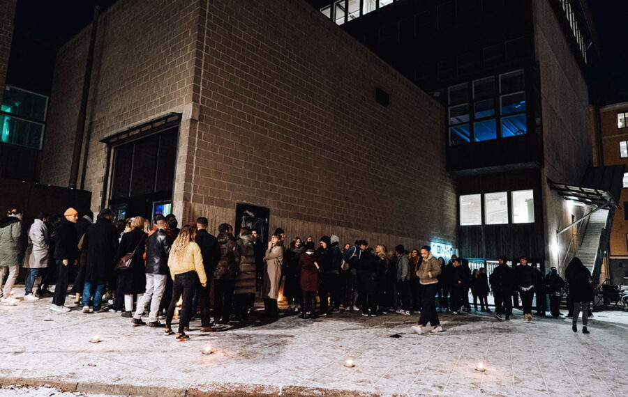 People standing in queue outside A-House