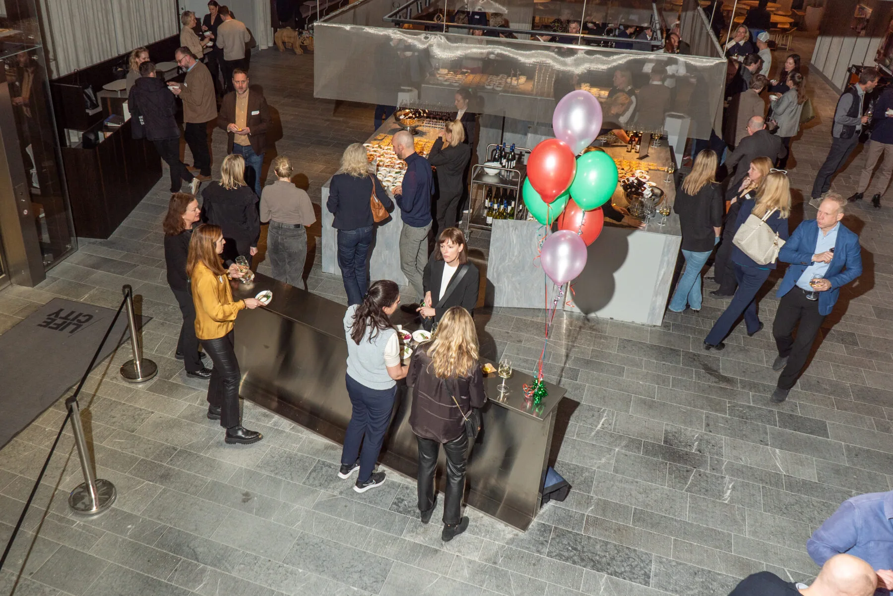 Festivities and mingling in A house Life City event venue lounch